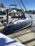 A boat lists on the docks. It probably took on water during the recent cold weather.